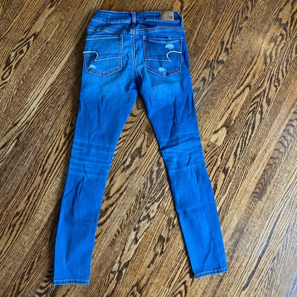 Blue jeans with rips - Picture 2 of 2